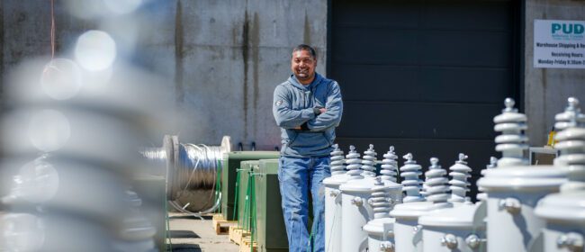 PUD Storekeeper Jesse Bland stands with a shipment of refurbished transformers at The PUD headquarters